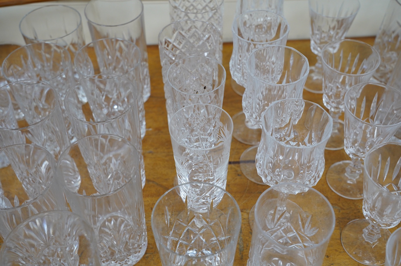 A collection of crystal glassware to include a set of ten tankards, wine glasses and tumblers, tallest 19cm. Condition - varies, mostly fair